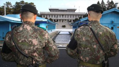 South Korean soldiers guard the DMZ dividing the two Koreas