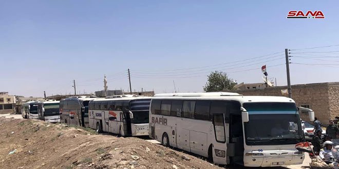 Buses enter the towns of Foua and Kafriya in Syria's Idlib province to evacuate residents to government-held territory.