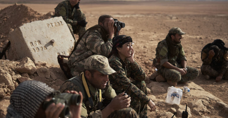 Rojda Felat surveys a flank of Tal al-Samam with other SDF commanders