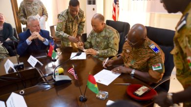 Maj. Gen. William J. Walker, Commanding General, District of Columbia National Guard and Brig. Gen. Moses Miningou the Chief of General Staff for the National Armed Forces of Burkina Faso, participate in a formal signing ceremony