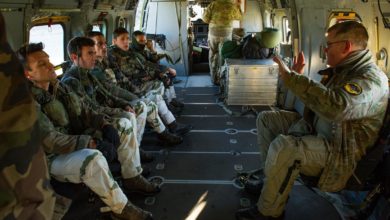 A Danish pilot gives a security brief to French Army troops