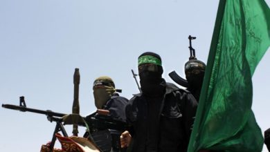 Hamas military personnel set atop military grade vehicles.