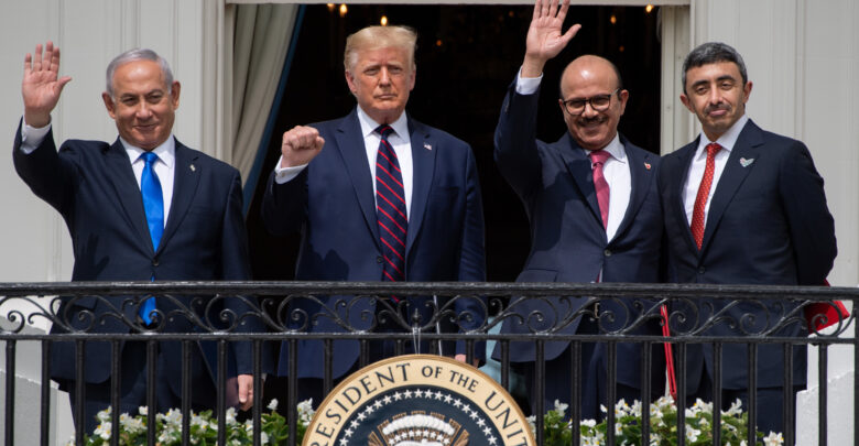 Israeli Prime Minister Benjamin Netanyahu, US President Donald Trump, Bahrain Foreign Minister Abdullatif al-Zayani, and UAE Foreign Minister Abdullah bin Zayed Al-Nahyan wave from the Truman Balcony at the White House after they participated in the signing of the Abraham Accords.