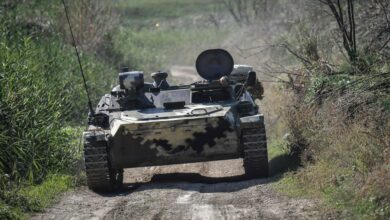 An Armenian armoured vehicle drives towards the front line on October 25, 2020, during the ongoing fighting between Armenian and Azerbaijani forces over the breakaway region of Nagorno Karabakh.