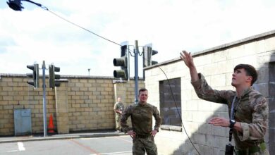 A Royal Marine commando lobs a "throwbot"
