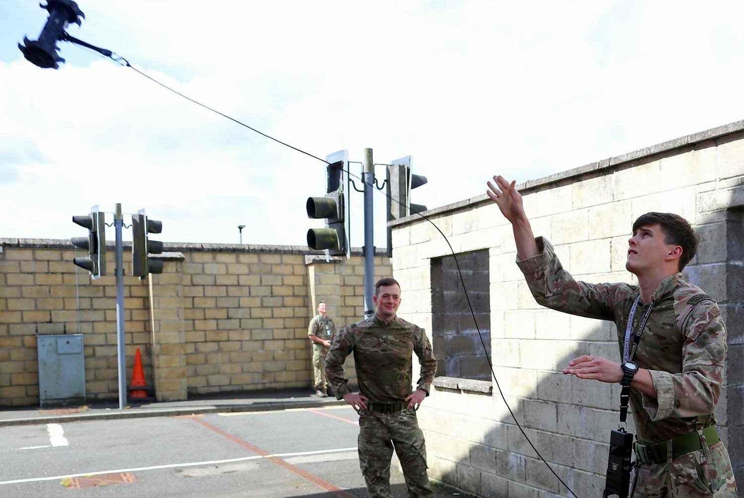A Royal Marine commando lobs a "throwbot"