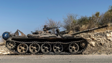 A damaged tank is abandoned on a road near Humera, Ethiopia, November 22, 2020