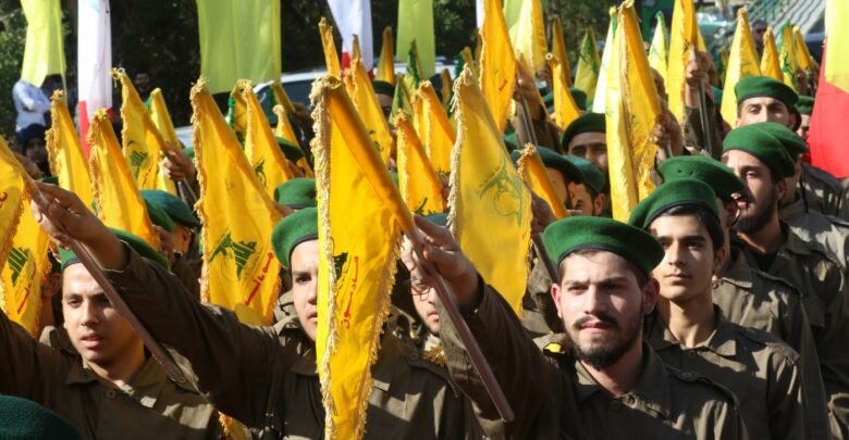 Hezbollah fighters take part in a military parade marking the group's Martyrs' Day in the southern town of Ghazieh, south of the port city of Sidon, 12 November 2019