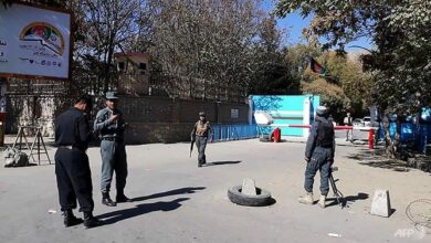 Policemen stand guard at an entrance gate of Kabul University in Kabul, Afghanistan, on November 2, 2020.