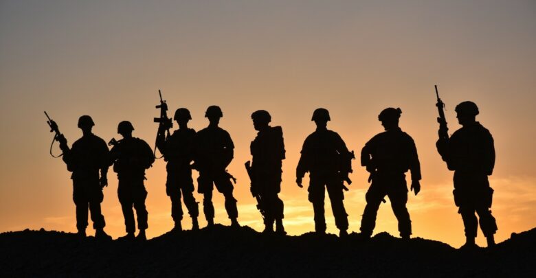 Soldiers from Task Force Stalwart, which is compromised of Soldiers from 1st Battalion, 41st Infantry Regiment, 2nd Brigade Combat Team, 4th Infantry Division, pose for a group photo, March 28, 2018, in a post in the outskirts of Afghanistan.