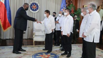Philippine President Rodrigo Duterte greeting US Secretary of Defense Lloyd Austin during a courtesy call at Malacanang Palace in Manila