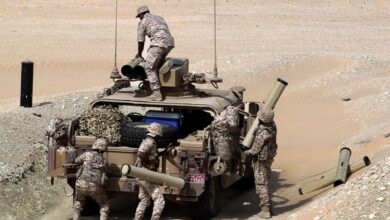 UAE soldiers load their military vehicle with rockets during manoeuvres with the French army in the desert of Abu Dhabi