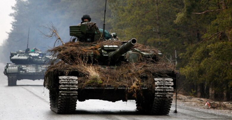 Ukrainian tanks move on a road