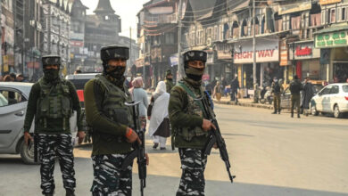 Indian paramilitary troopers stand guard during a random search along a street in Srinagar, Indian-administered Kashmir