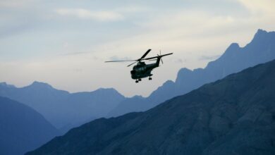 Military helicopter in flight in Hunza region of Karokoram Mountains, Pakistan