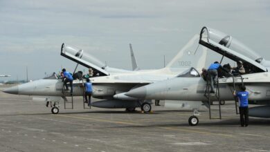 Korea Aerospace Industries ground crew inspect FA-50 multirole light fighter aircraft.
