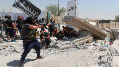 Members of Saraya al-Salam, a group linked to cleric Muqtada al-Sadr, clash with security forces in Baghdad’s Green Zone