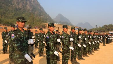 Karen National Liberation Army soldiers taking part in a parade for the 70th anniversary of the Karen revolution at a remote base