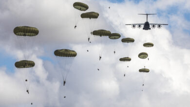 British Army paratroopers descending from A400M Atlas aircraft.