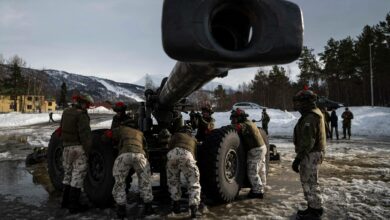 Soldiers from the Finnish Defense Forces operate the Tampella 155 K 83-97, a towed 155 mm field gun, during an international exercise in Setermoen, Norway, on March 22