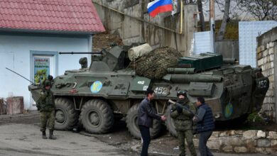 Men interact with Russian peacekeepers in the town of Lachin, Nagorno-Karabakh region, Azerbaijan