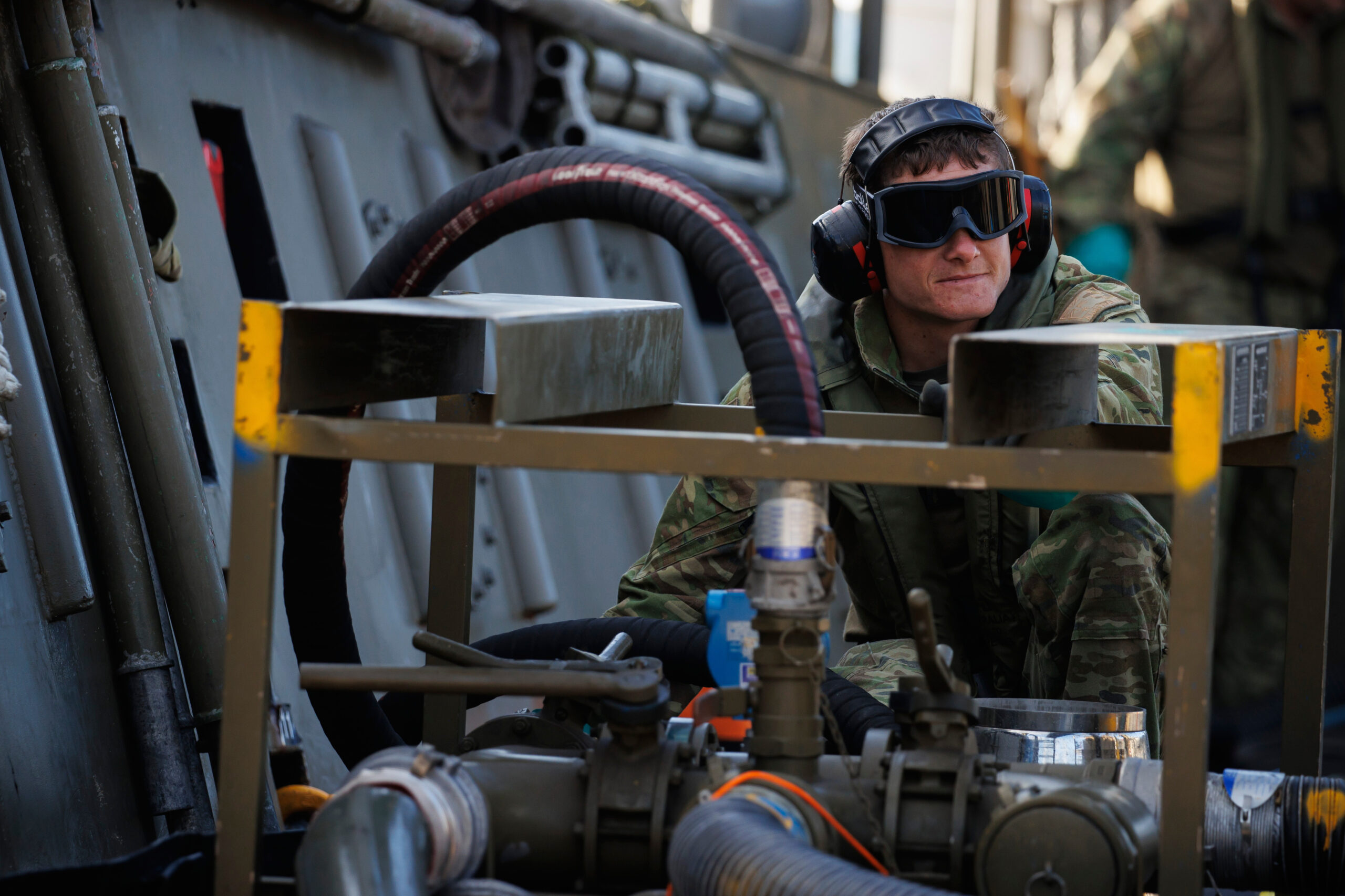 Petroleum Operator Private Chris Hornby from 17th Sustainment Brigade pumps fuel from an LCM8 to land during Exercise Overland - Nautical Petros 22, at Cowley Beach Training Area in Queensland. *** Local Caption *** Petroleum Operators from 17th Sustainment Brigade conducted Exercise Overland - Nautical Petros 22 (EX ONP 22), at Cowley Beach Training Area in Queensland, the 1st to the 19th of August 2022. EX ONP 22 aimed to qualify Petroleum Operators in the collective operation and supervision of a suite of petroleum capabilities. This included establishing bulk fuel storage areas, Inland Pipeline Distribution System, Advanced Fuel Quality Control and more. At the core of the Exercise was the demonstration of the ADFs capability of moving fuel from a ship to land without support from fixed infrastructure, which falls into its light ship-to-shore transfer capability.