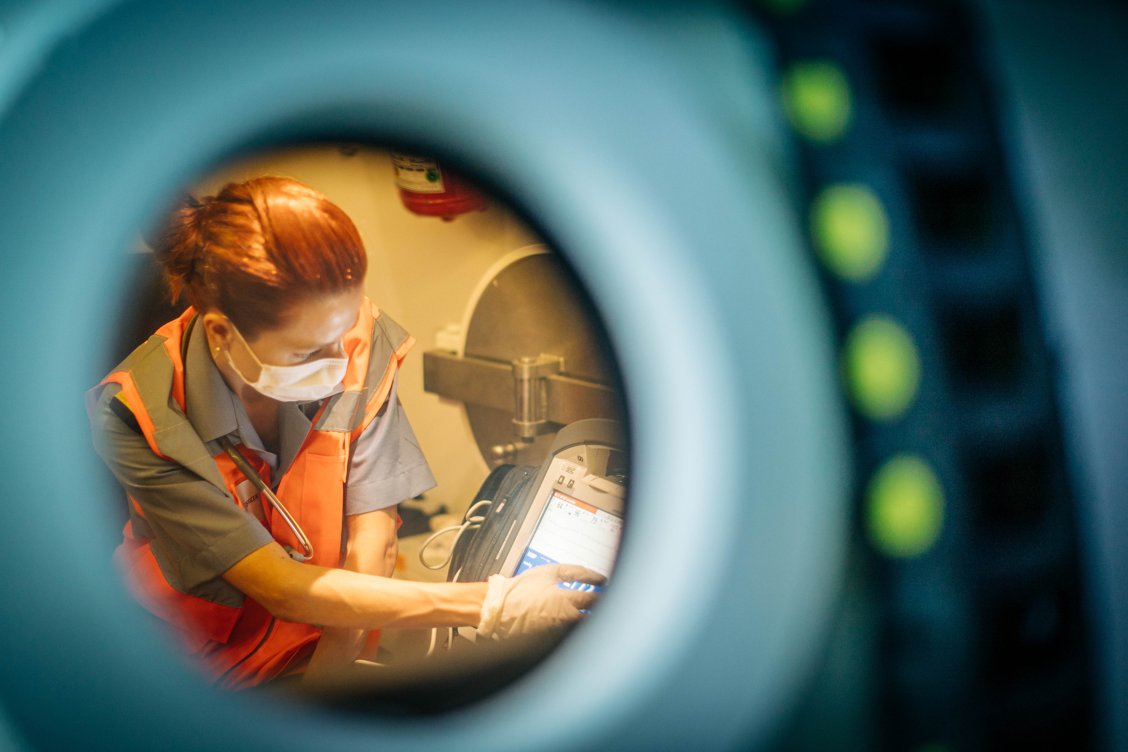 Turkish medical personnel practise providing emergency medical assistance to injured submariners suffering from decompression illness in a decompression chamber aboard TCG Alemdar (A-582) during exercise Dynamic Monarch/Kurtaran 2021