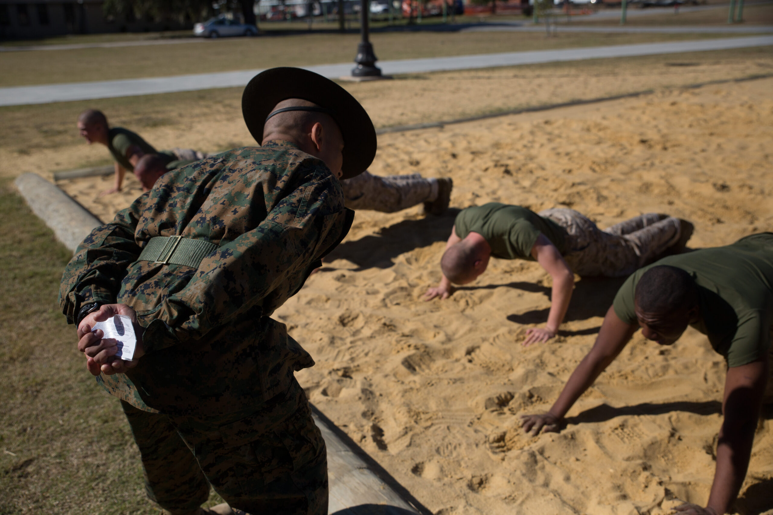 Staff Sgt. Angel Olmo, a drill instructor of Platoon 1001, Alpha Company, 1st Recruit Training Battalion, works to instill discipline in his recruits during an incentive training session Nov. 14, 2013, on Parris Island, S.C. Incentive training consists of physical exercises administered in a controlled and deliberate manner and is used to correct minor disciplinary infractions. Olmo is a 27-year-old native of Kissimmee, Fla. Alpha Company is scheduled to graduate Jan. 24, 2014. Parris Island has been the site of Marine Corps recruit training since Nov. 1, 1915. Today, approximately 20,000 recruits come to Parris Island annually for the chance to become United States Marines by enduring 13 weeks of rigorous, transformative training. Parris Island is home to entry-level enlisted training for 50 percent of males and 100 percent of females in the Marine Corps. (Photo by Lance Cpl. MaryAnn Hill)