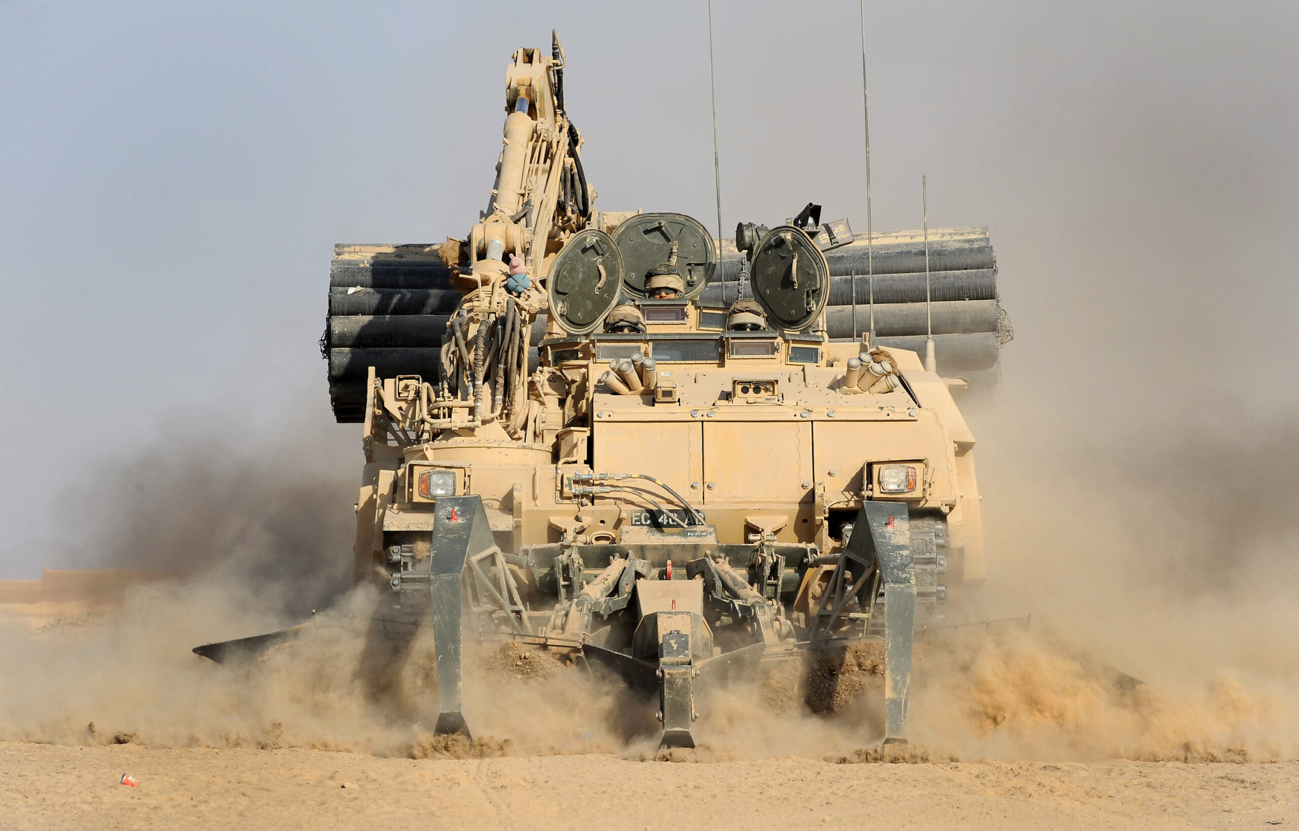 A mighty Trojan Tank belonging to 5 Armoured Engineer Squadron, cuts through the sand on Operation Hamkari in Afghanistan. The AVRE (Armoured Vehicle Royal Engineers) is used in conjuction with other vehicles and the Python weapon system for clearing IEDs (Improvised Explosive Devices). The bulk of British military operations in Afghanistan are concentrated in central Helmand. But Royal Engineers have spent the past two months lending their awesome capabilities to Afghan and US forces clearing a key area of Kandahar province. Since September, 5 Armoured Engineer Squadron, part of 23 Engineer Regiment (Air Assault), have provided close engineering support to the 2nd Battalion of the US ArmyÕs 502nd Regiment, and their partnered Afghan National Army kandak, in KandaharÕs Zharay district. Zharay district contains the Horn of Panjwai, an insurgent stronghold from where attacks on Kandahar City have been enabled and supported, and Sangsar, the Taleban's spiritual birthplace and former home of Mullah Omar. Under this effort, known as Operation HAMKARI - or as the soldiers call it "The Battle of Kandahar" - the intent has been to defeat insurgent elements and increase Afghan government influence across the area, as well as enable development west of Kandahar City.