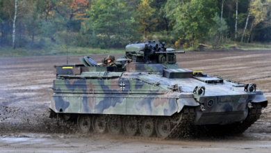 Marder infantry fighting vehicle of the German armed forces Bundeswehr drives through the mud