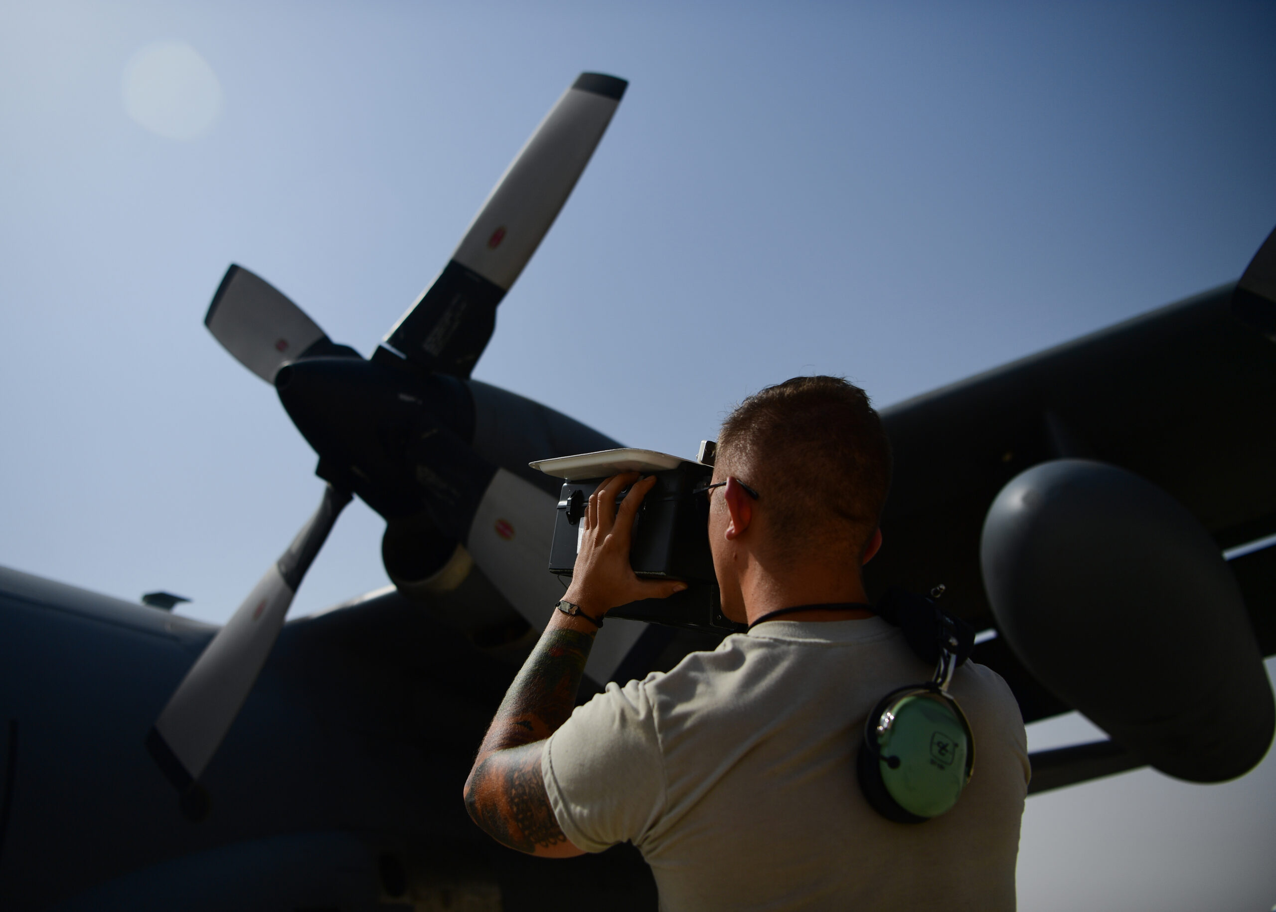 A U.S. Air Force avionics technician assigned to the 379th Expeditionary Aircraft Maintenance Squadron, performs an Identification, Friend-or-Foe check on a C-130 Hercules at Al Udeid Air Base, Qatar, Aug. 13, 2019. IFF is an identification system designed for command and control that enables military and national interrogation systems to identify aircraft, vehicles or forces as friendly, and to determine their bearing and range from the interrogator. (U.S. Air Force photo by Staff Sgt. Chris Drzazgowski)