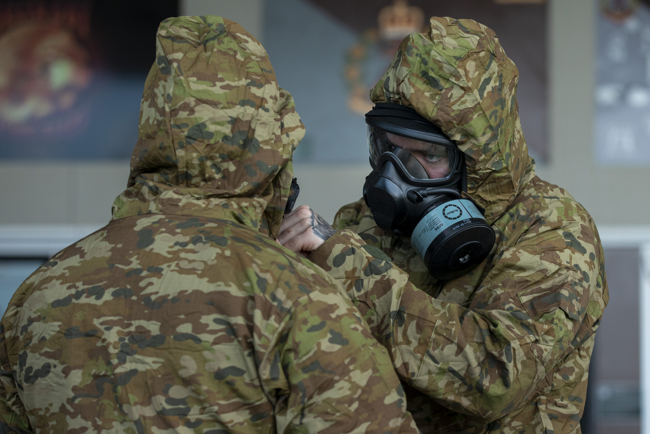 Australian Army soldiers from the 8th/9th Battalion, The Royal Australian Battalion conduct buddy checks during a Chemical, Biological, Radiological, Nuclear Defence (CBRN-D) training serial at Gallipoli Barracks, Queensland. *** Local Caption *** Soldiers from 8th/9th Battalion, The Royal Australian Regiment, conducted chemical, biological, radiological and nuclear defence (CBRN-D) training in April at Gallipoli Barracks, Brisbane. Members were educated about what to do in a location with a CBRN-D threat, and how to rapidly apply personal protective equipment. They were also trained on how to treat a casualty in that environment and evacuate them from the area.