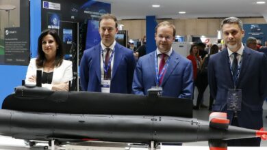 Navantia, SAES, and Perseo representatives at a defense and security expo in Madrid.