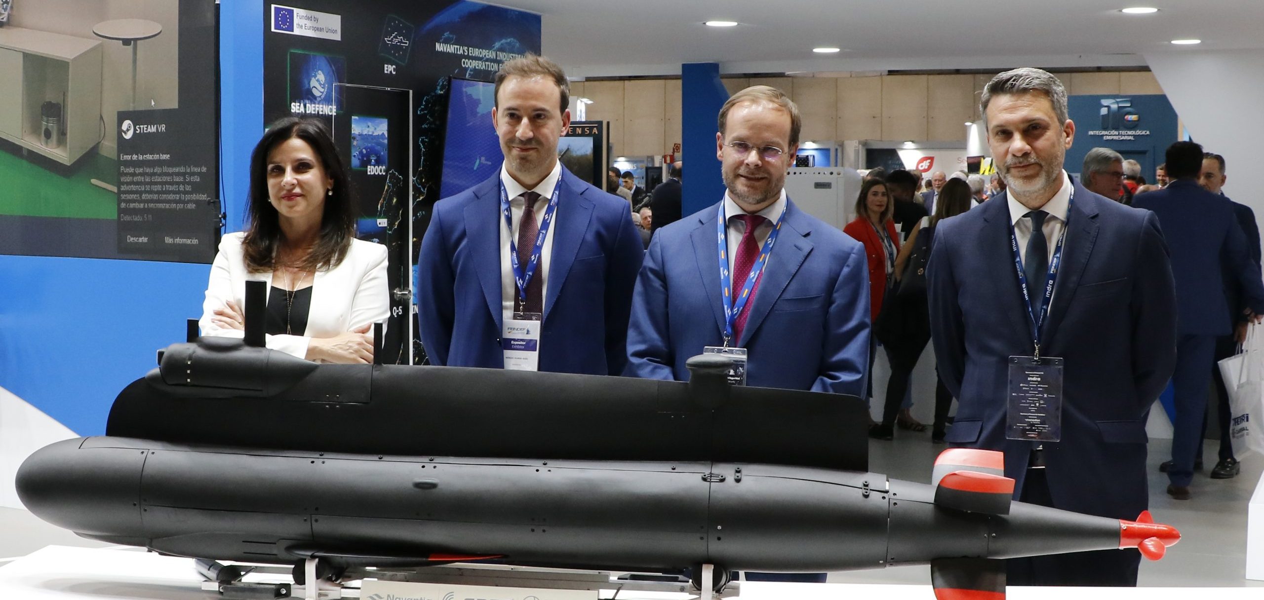 Navantia, SAES, and Perseo representatives at a defense and security expo in Madrid.