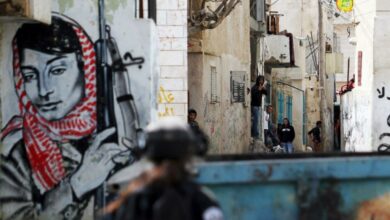 Palestinian demonstrators in Bethlehem with PFLP member and Palestinian resistance symbol Leila Khaled in the background
