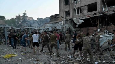 Rescuers and volunteers work to rescue people from under the rubble after a Russian missile strike hit a restaurant and several houses in Kramatorsk, eastern Ukraine, on June 27, 2023