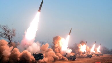 A North Korean artillery unit fires off missiles from an undisclosed location on the country's western coast