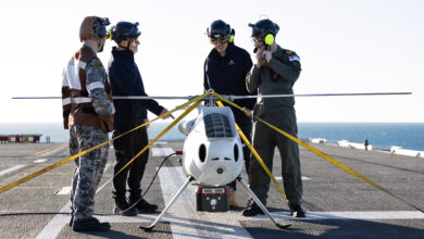 S100 Crew from 822X Squadron and Defence Science and Technology Group personnel discuss the S100 Bathymetric LiDAR Sensor trials on the Flight Deck of HMAS Adelaide during Exercise Sea Raider 23. *** Local Caption *** In July 2023 the Australian Defence Force conducted Exercise Sea Raider across the coast of North Queensland. Exercise Sea Raider certified the Amphibious Ready Unit and saw the Australian Amphibious Force train closely with the Royal Australian Navy's HMAS Adelaide and HMAS Choules, as well as a beach landing force comprising of infantry, armoured vehicles, artillery, aviation and logistic elements optimised for amphibious raids and assaults. The Sea Series of exercises enhances joint interoperability of the Australian Army and Royal Australian Navys amphibious capabilities.