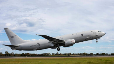 A Royal Australian Air Force P-8A Poseidon aircraft departs to Japan as part of Operation ARGOS. It hovers a few meters above ground just as it begins to take off.