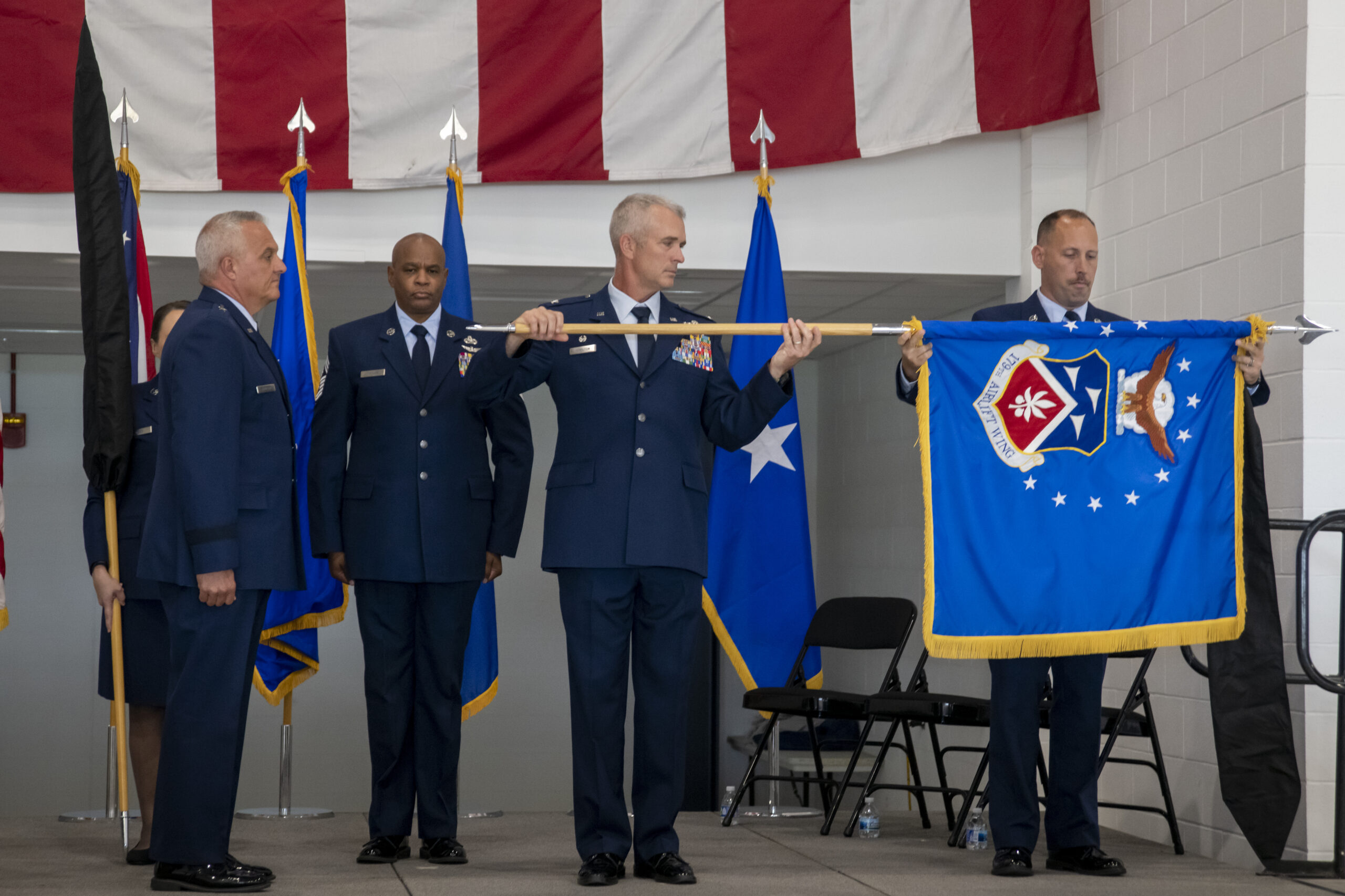 The 179th Airlift Wing, an Ohio Air National Guard unit, is redesignated as the 179th Cyberspace Wing during a ceremony held Sept. 9, 2023, at Mansfield-Lahm Air National Guard Base, Mansfield, Ohio. The redesignation is historically significant as the first Air National Guard base in the nation to become a cyberspace wing. (U.S. Air National Guard photo by Tech Sgt. Alexis Wade)
