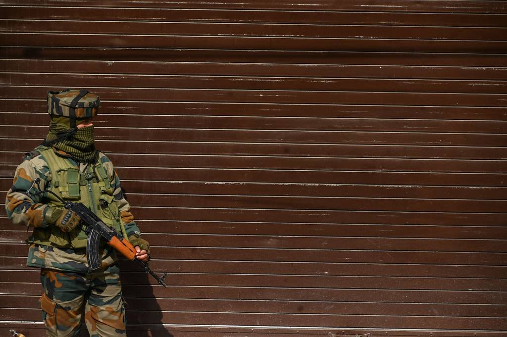 An Indian soldier stands guard in Srinagar, 2022