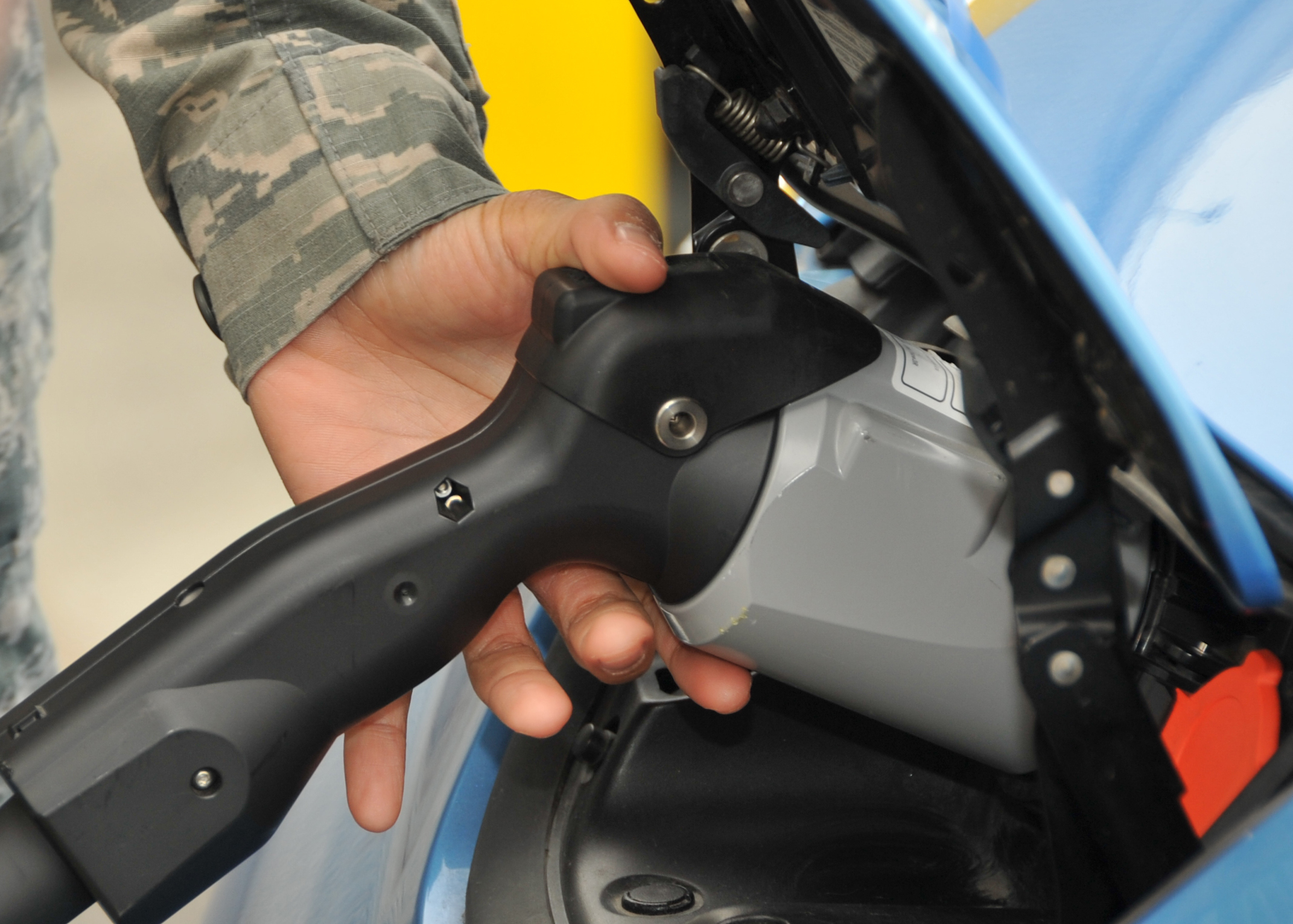 Airmen from Los Angeles Air Force Base learn how to use charging equipment for the base's new Electric Vehicle Fleet during a training demo in El Segundo, Calif., on Oct. 31, 2014. (U.S. Air Force photo by Sarah Corrice/RELEASED.)