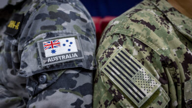 Australian Navy ensign and United States Navy ensign, side by side during Exercise Cyber Sentinels 23. *** Local Caption *** Exercise Cyber Sentinels is an annual cyber exercise which was held 2  13 October 2023 in Canberra. This was the first time this exercise was planned and held at the SECRET//REL Five Eyes level in Australia by the ADF, with previous exercises held by our global partners at a lower classification level. The ADF worked closely with United States Cyber Command (USCYBERCOM) in the planning of this exercise which is part of the global effort sharing of partner cyber readiness. Over 60 US Cyber Command personnel participated alongside over 90 ADF members. The participants were joined by a number of observers from Canada, New Zealand and the United Kingdom. The exercise comprised five blue force teams consisting of three Australian teams from Royal Australian Army 138 Signals Squadron, Royal Australian Air Force 462 Squadron and Royal Australian Navy Fleet Cyber Unit, and two teams from the United States, USFLEETCYBER and MARFORCYBER. Exercise Cyber Sentinels supports the training and development continuum of cyber units by honing individual and collective cyber-based skills. Additionally, the networking and learning opportunities from other nations are benefitting the ADF to further develop in the Cyber Domain and supporting reciprocal training opportunities in the future.