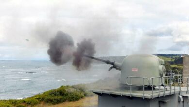 The 76mm medium caliber gun (MCG) installed at West Head gunnery range in Flinders, Victoria is seen firing a round of ammunition towards the sea.