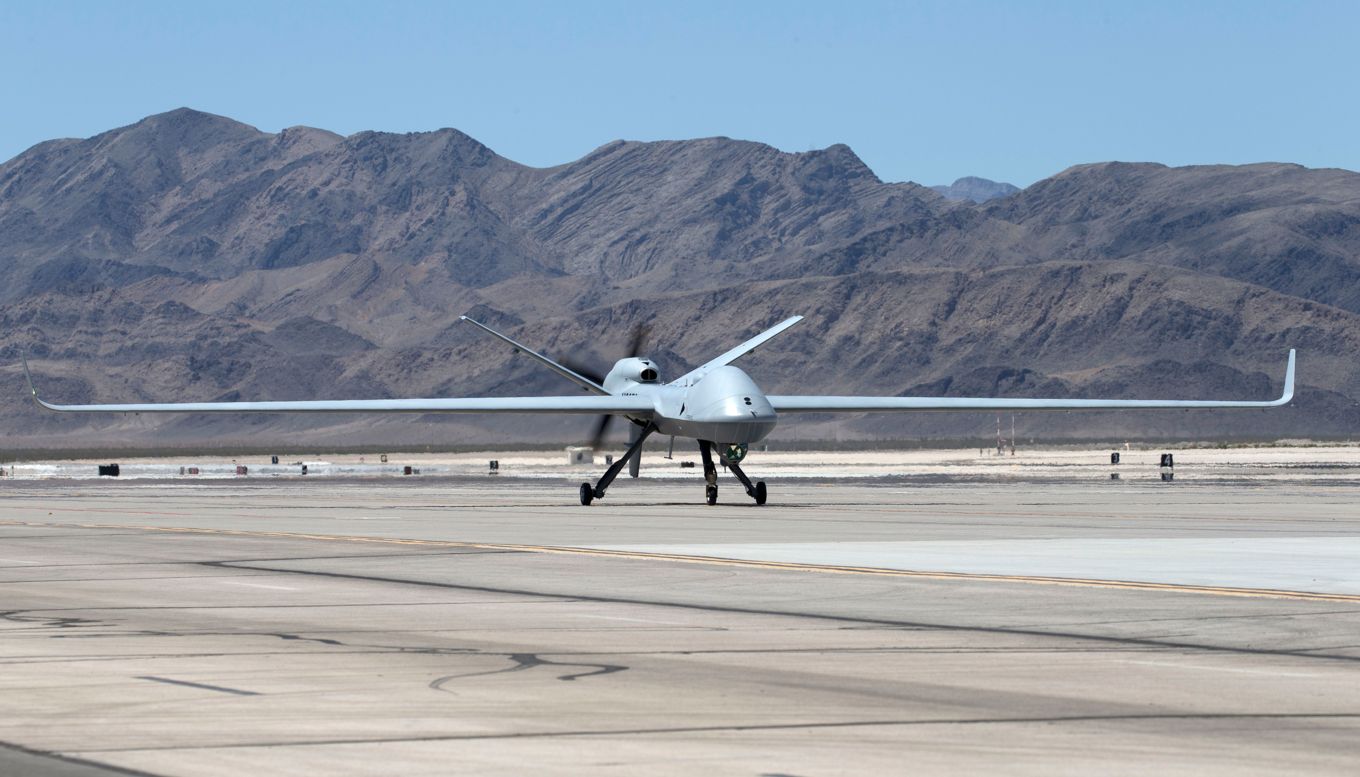 A UK Protector RG Mk 1 drone is seen on a runway, seemingly moments before takeoff.