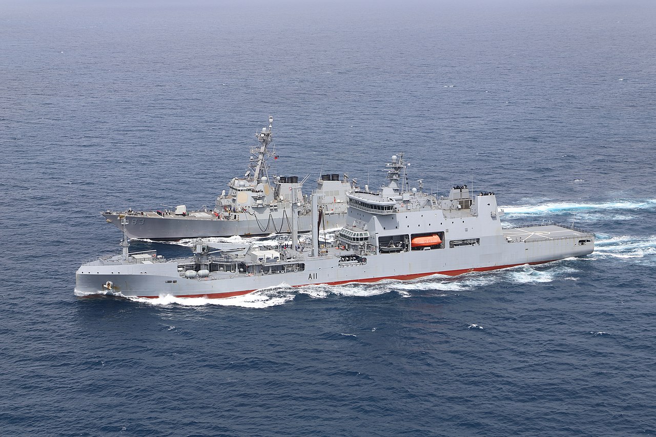 The Royal New Zealand Navy oiler HMNZS Aotearoa (A11) is seen sailing in the sea beside U.S. Navy guided-missile destroyer USS Howard (DDG-83).