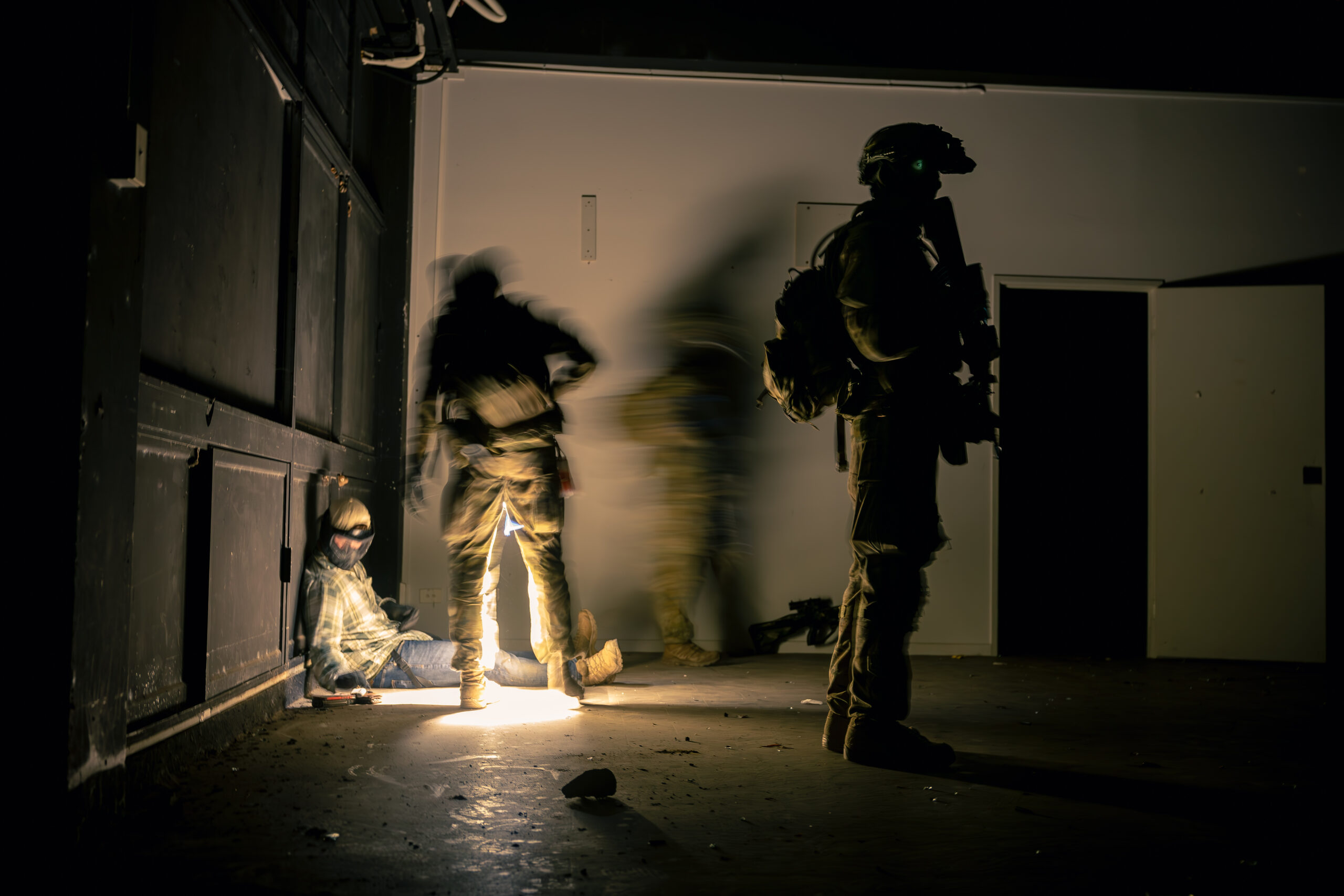 Australian Army soldiers from Charlie Company, 1st Battalion, The Royal Australian Regiment detain a simulated enemy during an urban clearance on Exercise Green Blaze at James Cook University, Townsville, Queensland. *** Local Caption *** Australian Army soldiers from Charlie Company, 1st Battalion, The Royal Australian Regiment conducted live-fire combat shooting serials, full mission profiles and air mobility operations as part of Exercise Green Blaze from 23 Oct  24 Nov 2023 at Lavarack Barracks and Mount Stuart Training Area, Townsville, Queensland.