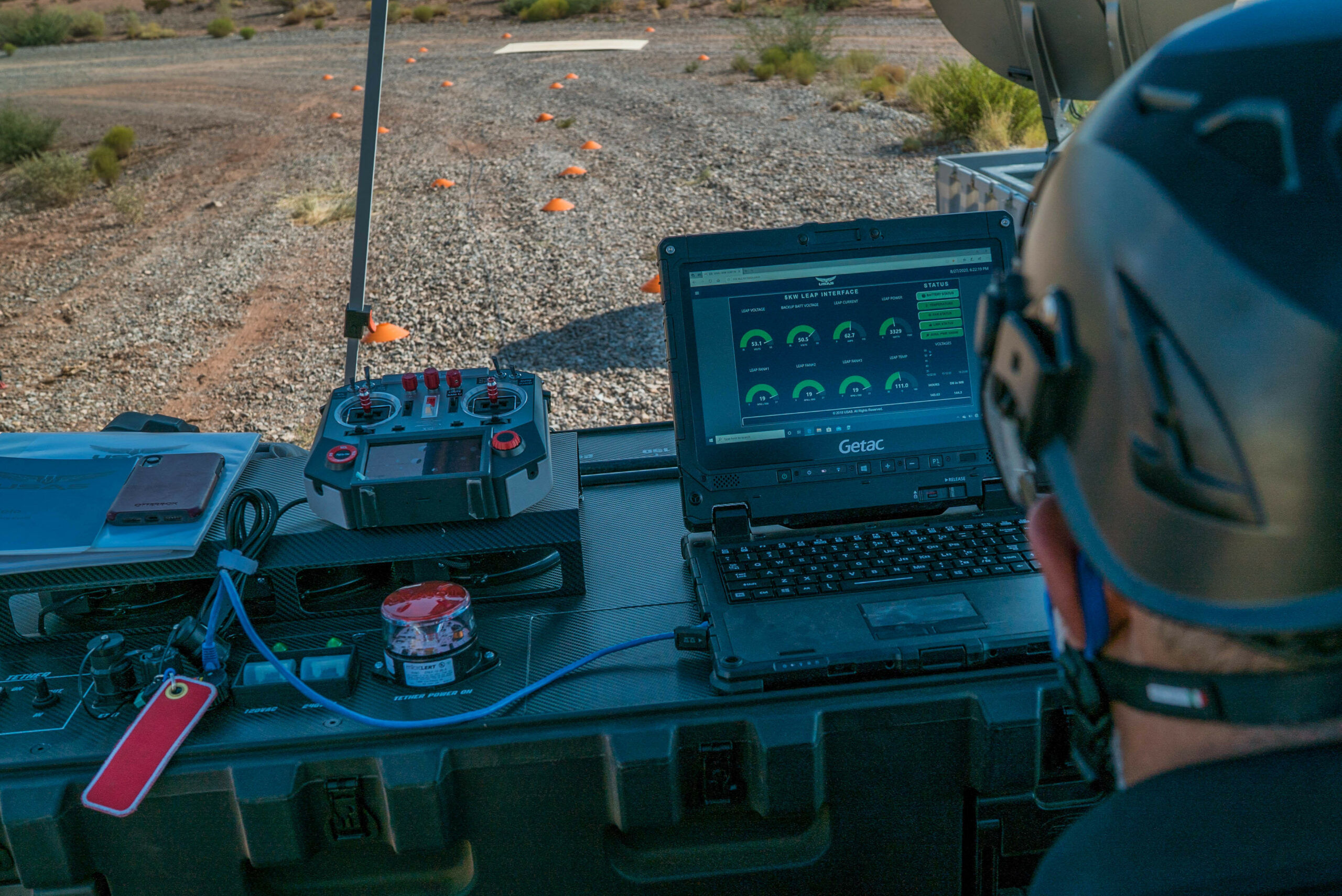 An AT&T civilian contractor monitors the status interface of a "Cell on Wings" drone in order to provide 5G connectivity to participants of the Advanced Battle Management Systems (ABMS) Onramp 2 at White Sands Missile Range, New Mexico on Aug. 27, 2020. The Advanced Battle Management System (ABMS) is an interconnected battle network - the digital architecture or foundation - which collects, processes and shares data relevant to warfighters in order to make better decisions faster in the kill chain. In order to achieve all-domain superiority, it requires that individual military activities not simply be de-conflicted, but rather integrated – activities in one domain must enhance the effectiveness of those in another domain. (U.S. Air Force photo by SSgt Charlye Alonso)
