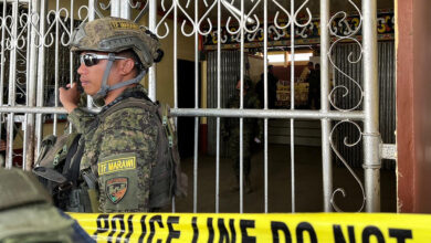 Philippine armed personnel after a bomb attack