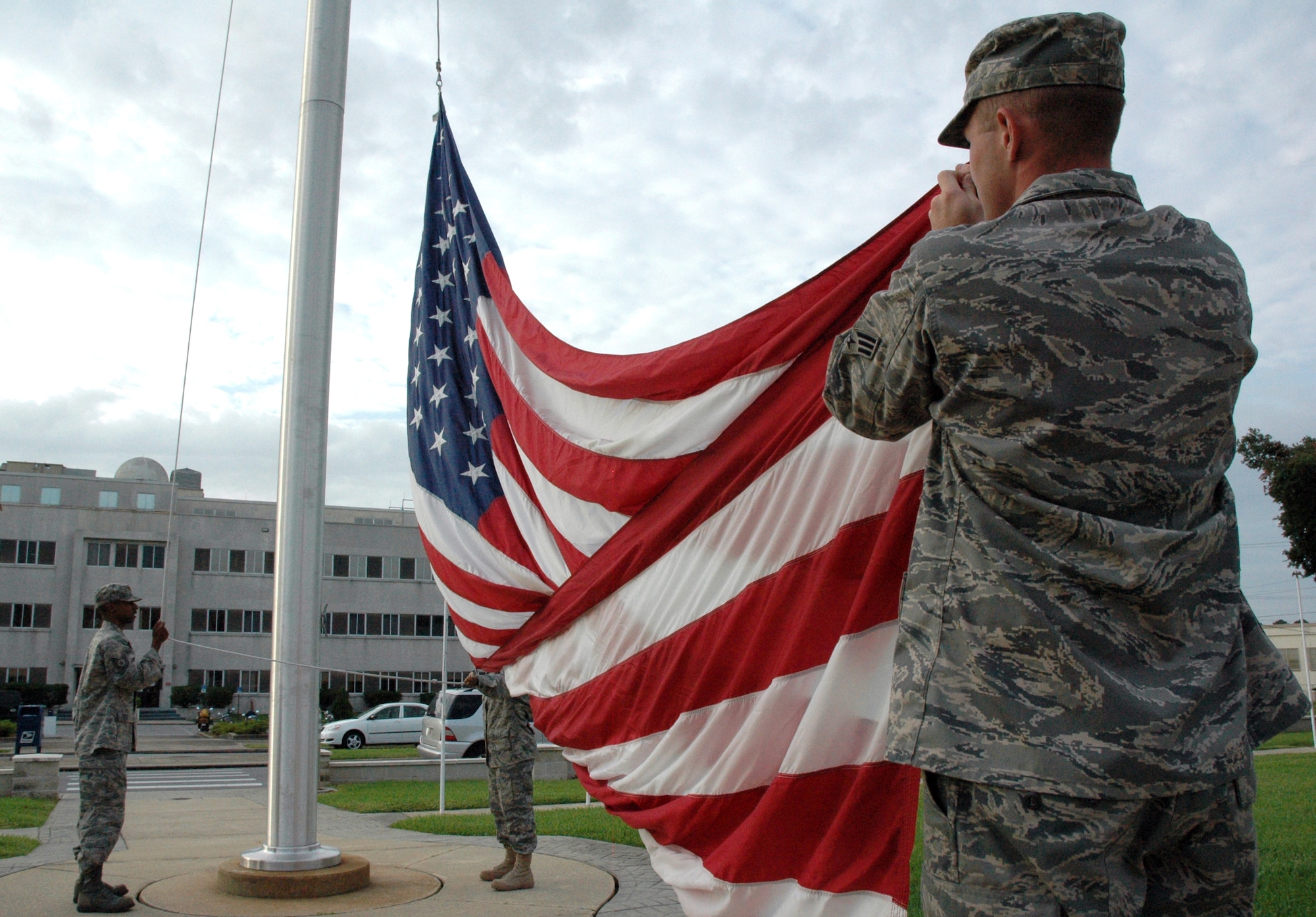 American soldier raising US flag